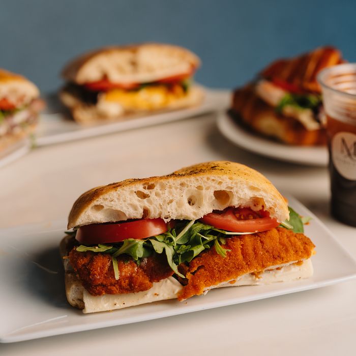 Spicy chicken ciabatta sandwich with tomato and arugula