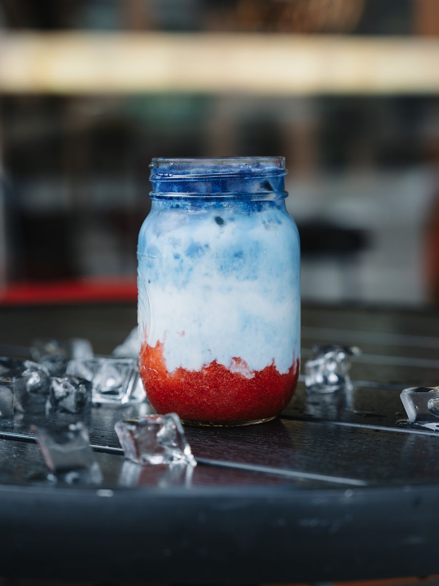Iced strawberry blue matcha in a glass jar at Momento Café