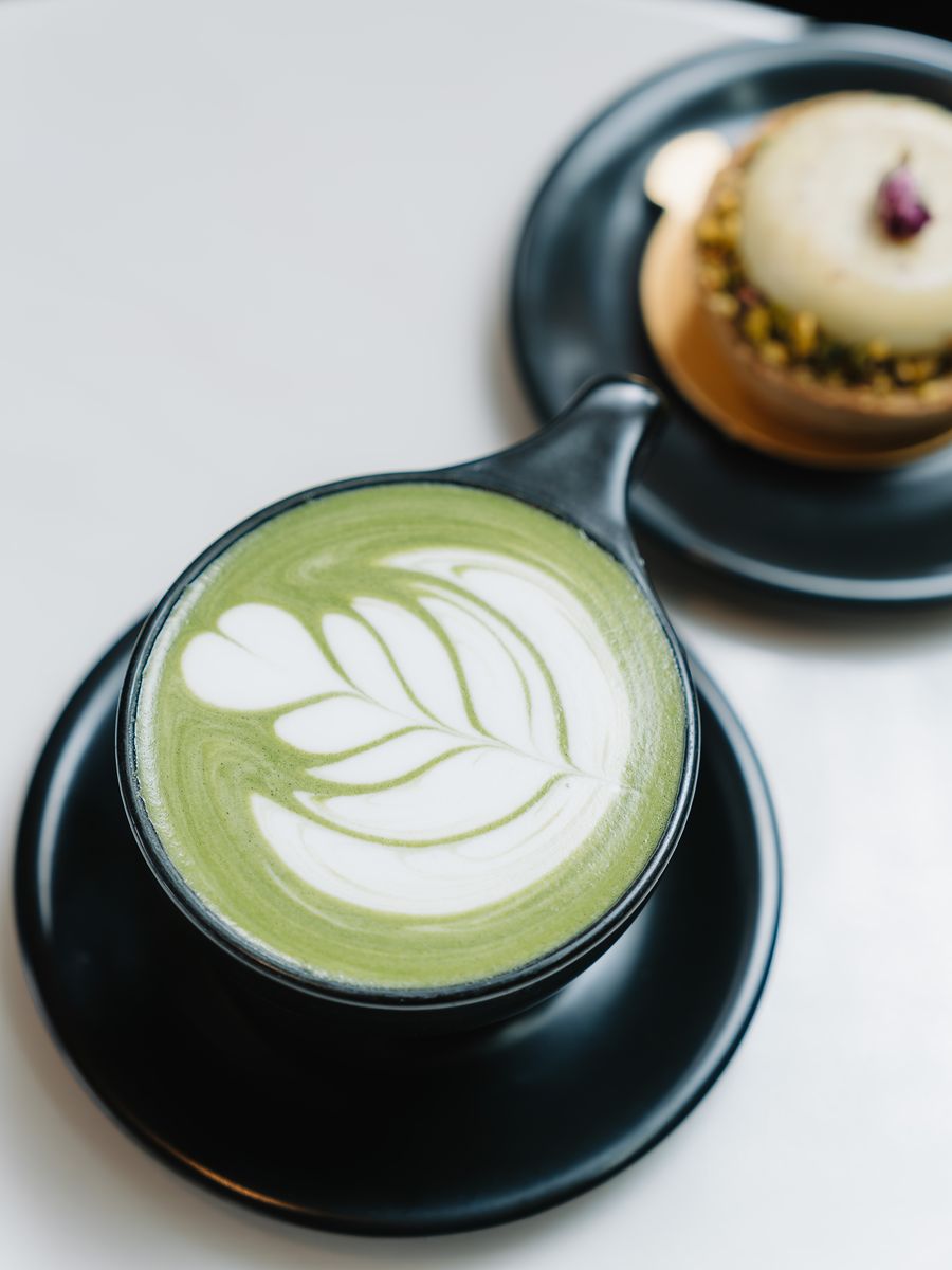 A matcha latte with leaf latte art at Momento Café