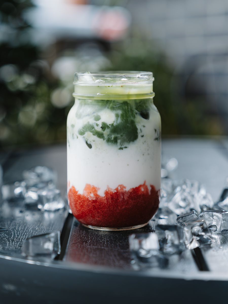 Iced strawberry matcha in a glass jar